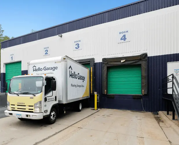 WareSpace exterior loading docks with numbered dock-high doors and a box truck backed in